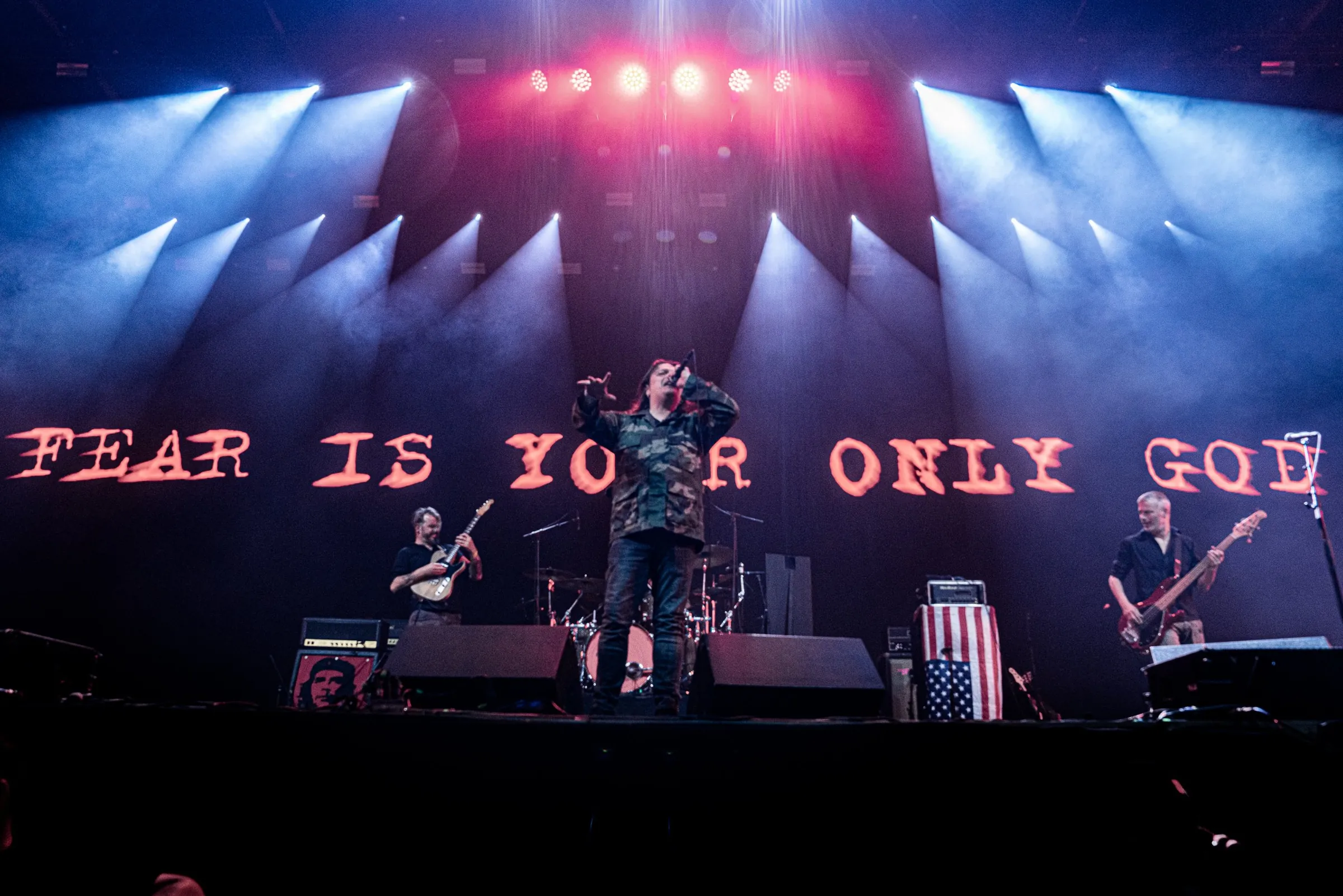 Full band on stage with synced visuals on the LED wall
